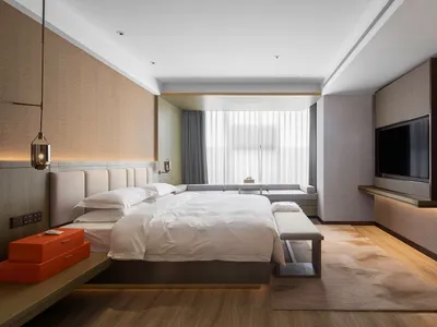 Modern bedroom featuring a neutral-toned color palette
