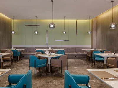 A sleek, modern restaurant dining room with contemporary decor and clean lines.