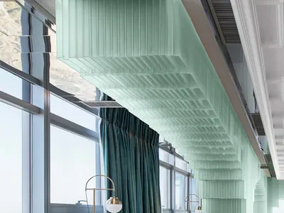 Modern restaurant interior with glass walls, concrete flooring, and tiled accents