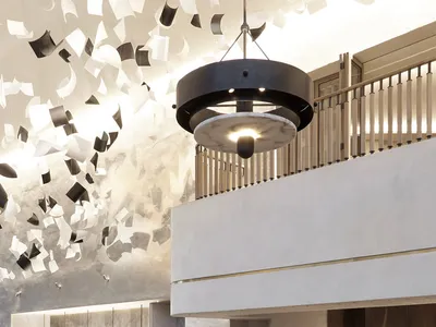 A modern casual restaurant featuring concrete, marble, and wooden elements.