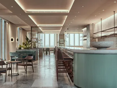 A modern restaurant bar with concrete and glass elements and green plants.