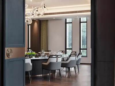 Modern restaurant interior with contemporary furniture and lighting.