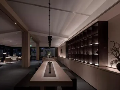 現代酒店大廳，鋪設混凝土地板、木質座椅與淺色金屬點綴。