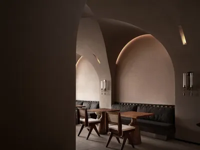 A modern restaurant interior with minimalist design, black leather sofas, and wooden furniture.