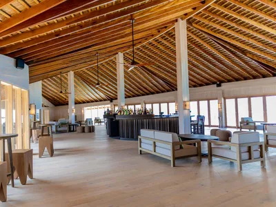 Modern hotel lobby featuring wood materials and minimalistic design elements