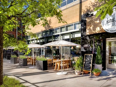 Modern restaurant exterior with concrete and glass materials
