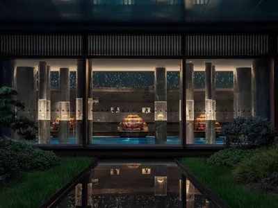 Modern hotel suite featuring glass columns in a sleek, contemporary design.