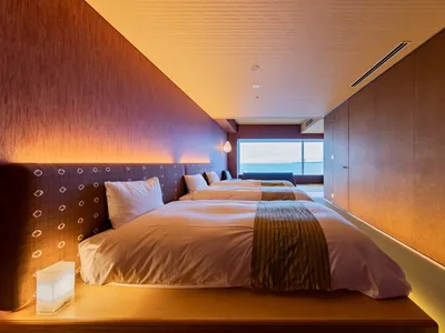 Modern hotel room featuring plush textiles and wooden elements