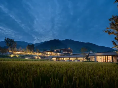 Modern restaurant exterior with glass and stone materials