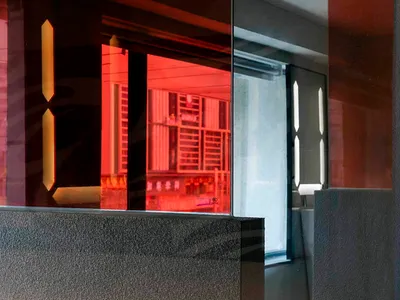 An image of a modern hotel lobby with glass walls.