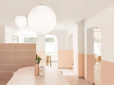 Minimalist restaurant interior with concrete and terrazzo materials