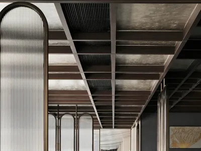 Contemporary restaurant interior featuring metallic glass panels and concrete flooring.