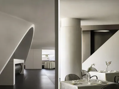 Modern restaurant interior with concrete walls and minimalist design