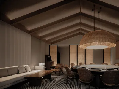 Industrial-style lounge and dining area featuring wood furniture and decorative woven lighting.