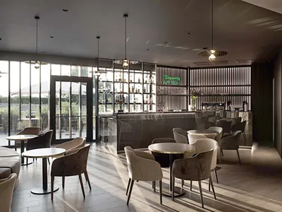 Modern restaurant bar area with concrete flooring and minimalist decor.
