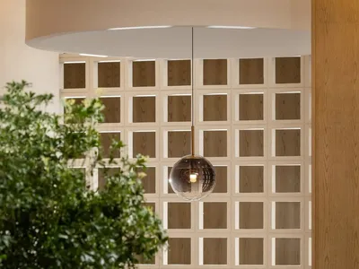 An industrial-style restaurant interior featuring wooden elements and a modern design.