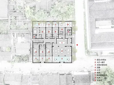 A black and white floor plan of a hotel drawn on paper, featuring various labeled rooms and spaces such as reception, lobby,