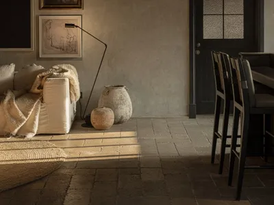 Industrial living room with concrete walls and minimalist decor.