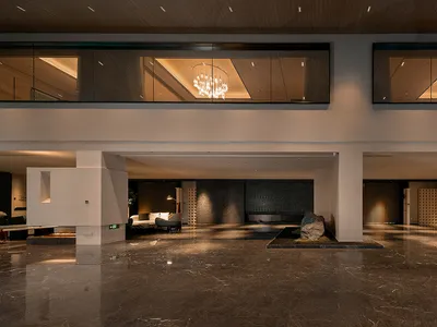 Modern hotel lobby featuring sleek marble construction and contemporary design elements.