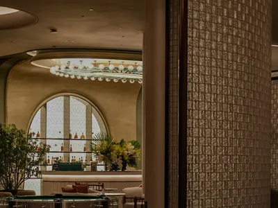 Modern restaurant interior featuring brick and clay tiles with mosaic patterns