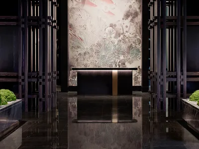 Modern hotel lobby with dark wood, glass, and concrete design elements.