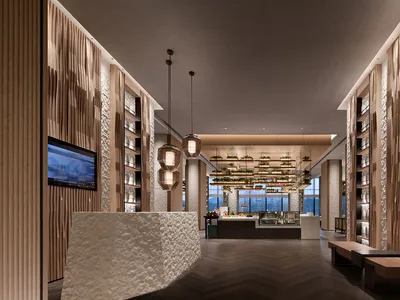 Modern restaurant hallway designed with marble and wood elements