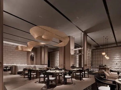 A modern restaurant interior with wooden bench seating, round tables, and circular lighting fixtures.
