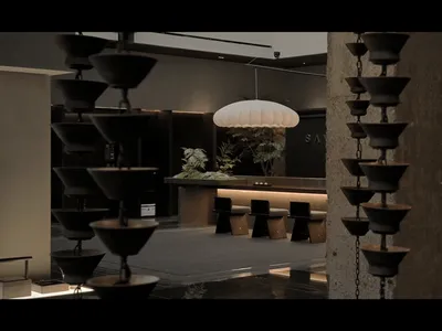Modern restaurant interior with concrete floors, metal railings, and glass walls