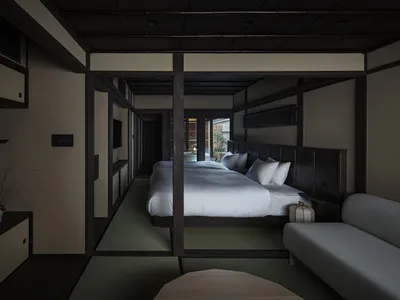 Modern bedroom featuring hardwood floors and tatami mats