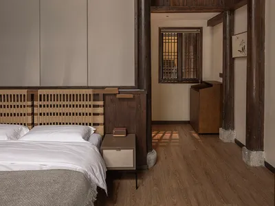 A minimalist bedroom featuring wooden elements