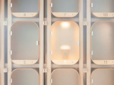 Minimalist hotel lobby featuring glass lighting fixtures