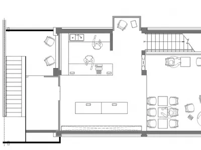Floor plan of a modern restaurant featuring concrete, glass, and metal materials.