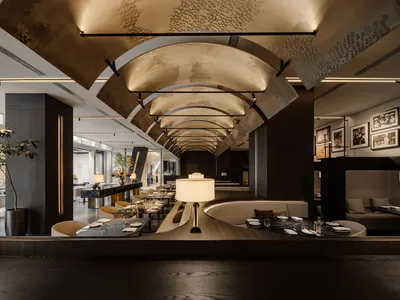 Modern restaurant with metallic ceiling and tables, featuring contemporary design elements.