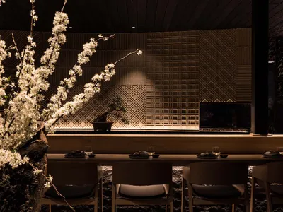 Modern restaurant interior with dark space, contemporary design, and contemporary furniture.