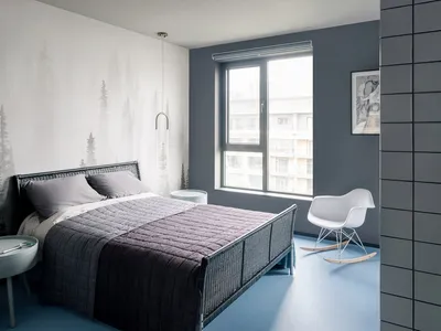 A modern minimalist bedroom featuring a rattan bed frame and minimalist decor.