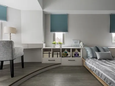 A minimalist bedroom with a wood-patterned floor, grey furniture, and turquoise accents.