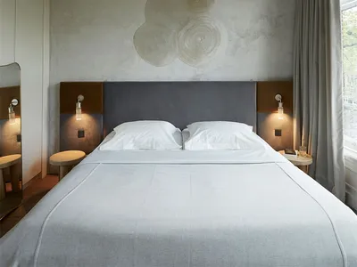 Minimalist bedroom with neutral colors and simple furniture