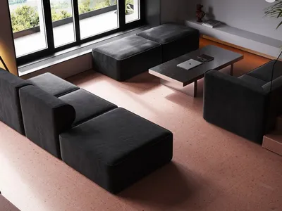 A modern, industrial-style living room featuring concrete furniture and minimalist decor.
