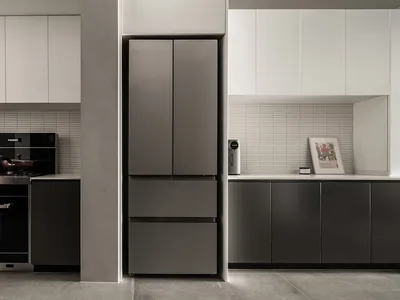 A modern minimalist kitchen featuring composite panels with sleek, clean design and efficient use of space.