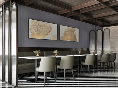 Modern restaurant interior featuring black, white, glass, and metal elements.
