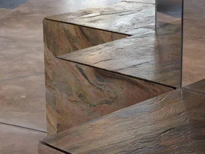 A modern marble countertop with a polished stone slab, giving an elegant and luxurious appearance