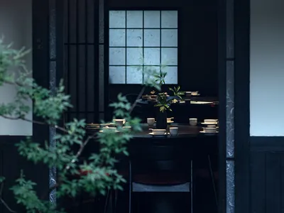 黑白主題亞洲餐廳內部，設有餐桌、椅子與盆栽，營造溫馨舒適的氛圍