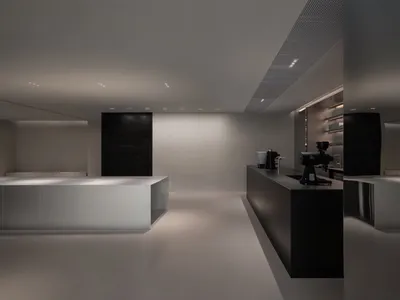 白色牆面與地板的商用廚房，配備現代家電與極簡設計