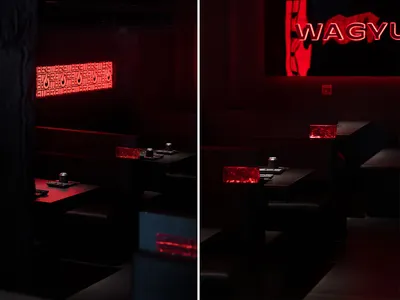 深沉親密的餐廳內部，配有多張餐桌與椅子，營造溫馨氛圍