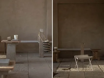 A restaurant interior with benches and a dining table, featuring various seating options and cups for serving drinks
