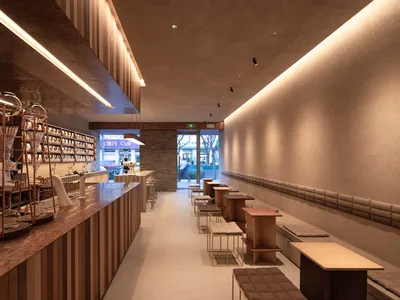 溫馨咖啡廳設有吧台與多張用餐桌，提供舒適座椅與社交氛圍