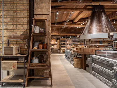 A cozy retail space with various items on display, including bottles and bowls, set in a warm and inviting atmosphere