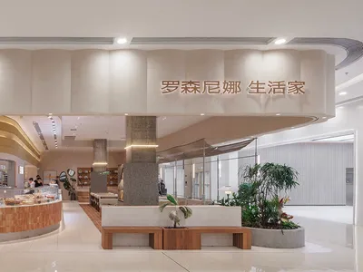 A restaurant interior with a large dining area featuring benches and chairs, tables, and a clock on the wall, creating an inviting and comfortable atmosphere