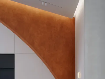 A modern dining space with wooden tables and chairs, warm orange walls, and a cozy atmosphere