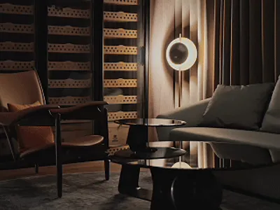 Elegant living space with a dining table, chairs, and a wine rack, featuring a sophisticated atmosphere with a focus on comfort and functionality